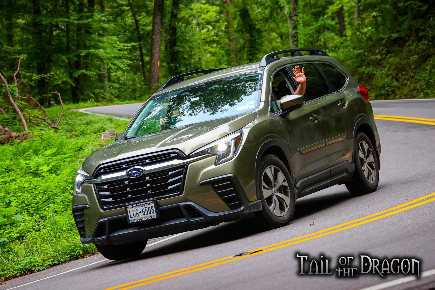 Green 2024 Subaru Ascent cornering on the Tail of the Dragon
