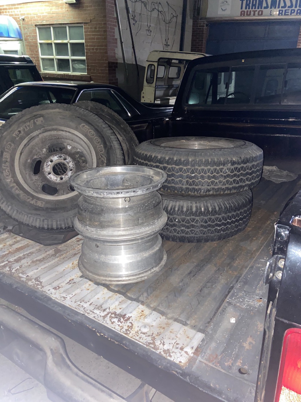Steel wheels and tires in the bed of a pickup