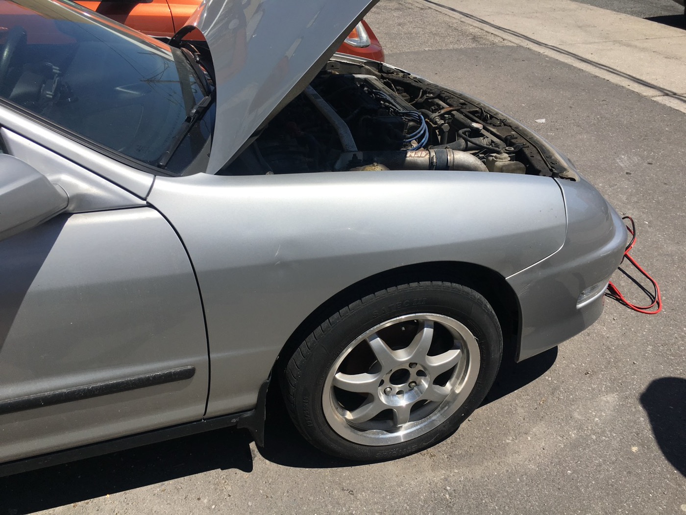 Silver Integra LS with the hood up