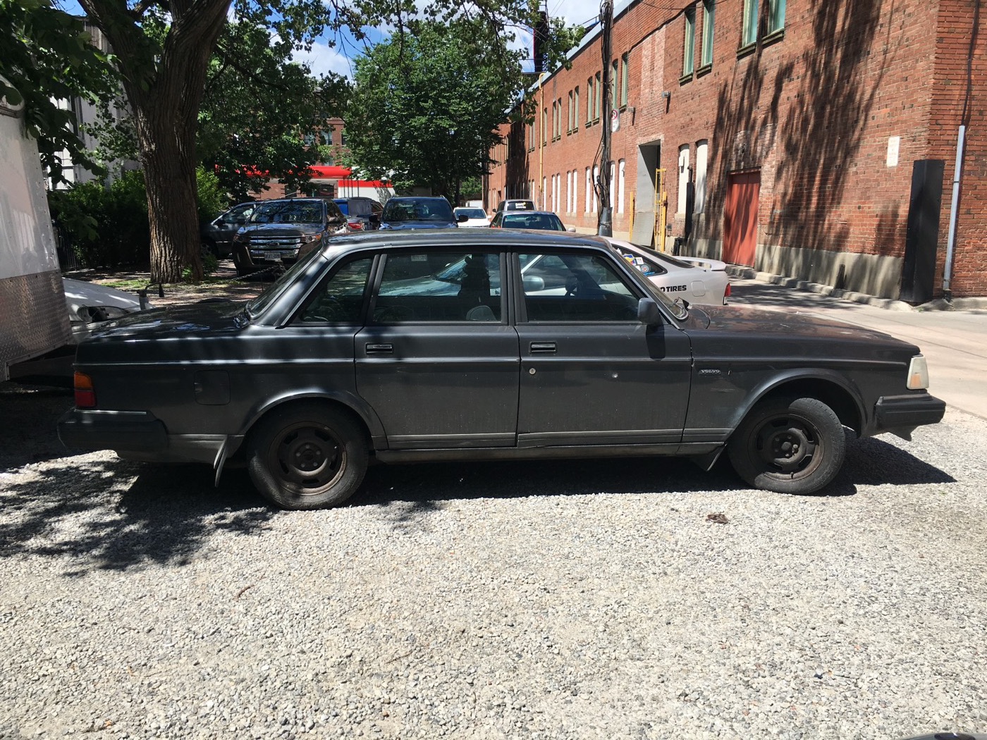 Grey 1992 Volvo 240 DL sedan parked on a street